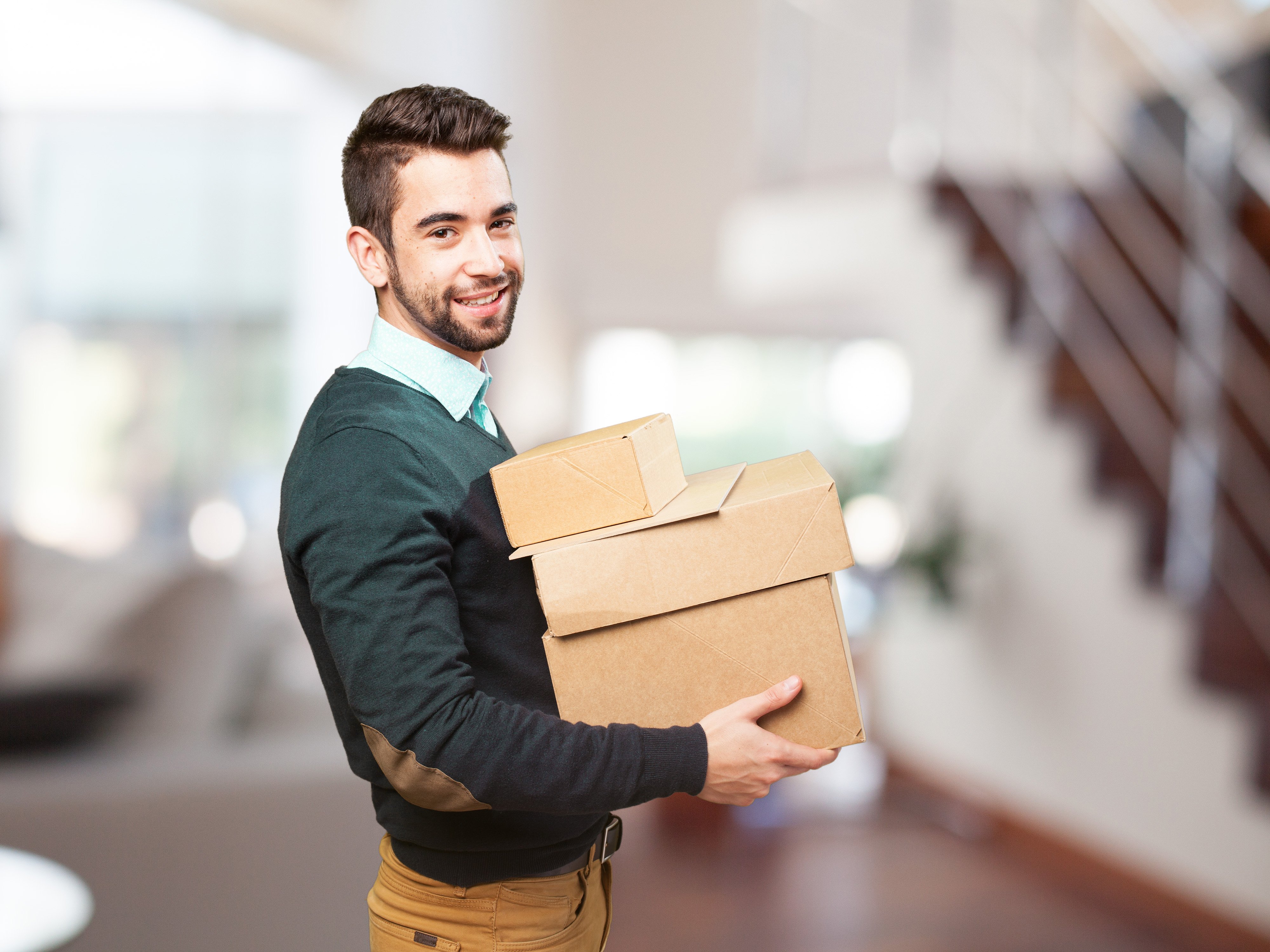 man-smiling-with-lot-boxes