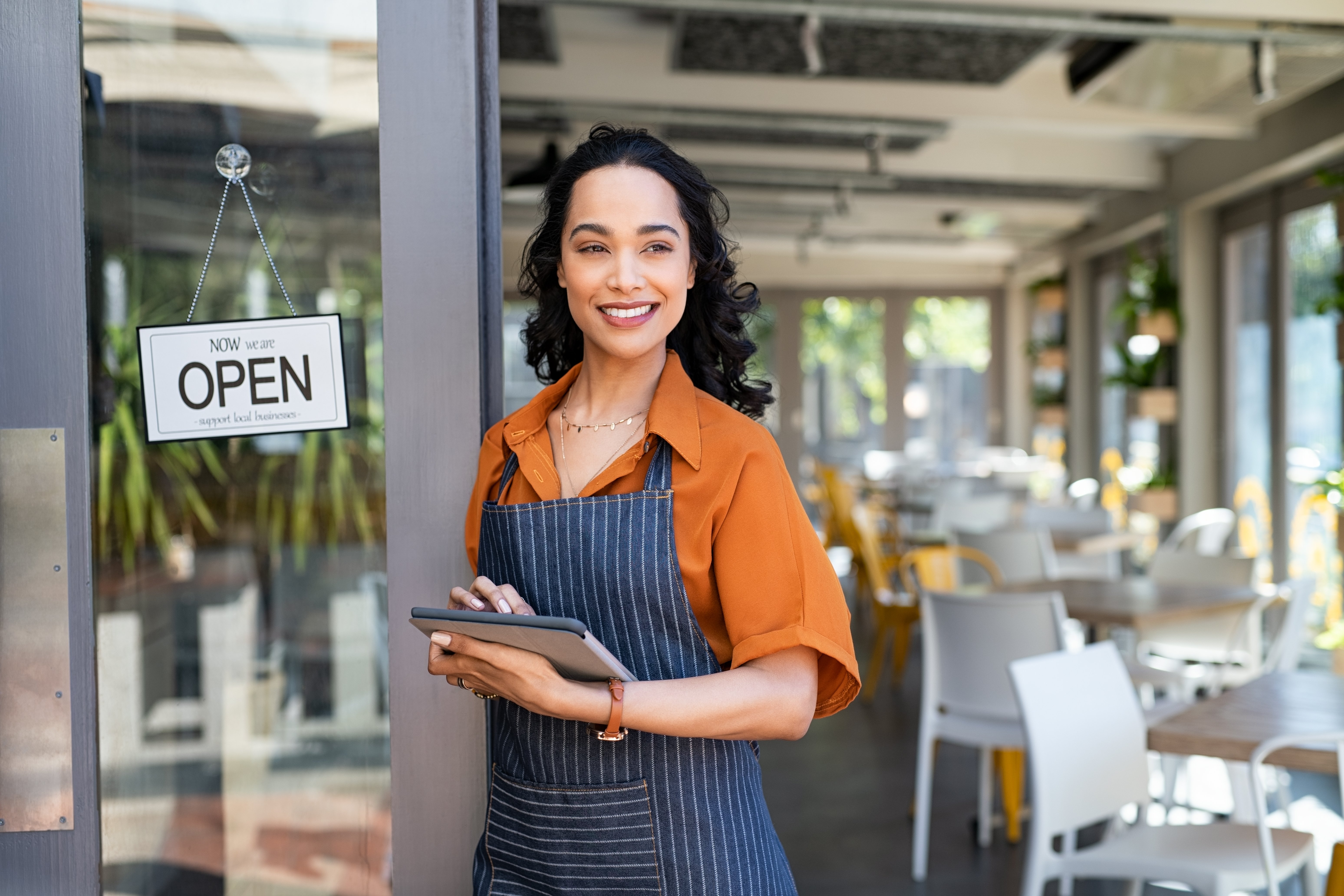 small-business-entrepreneur-at-cafe-entrance-using-2022-02-15-23-29-57-utc