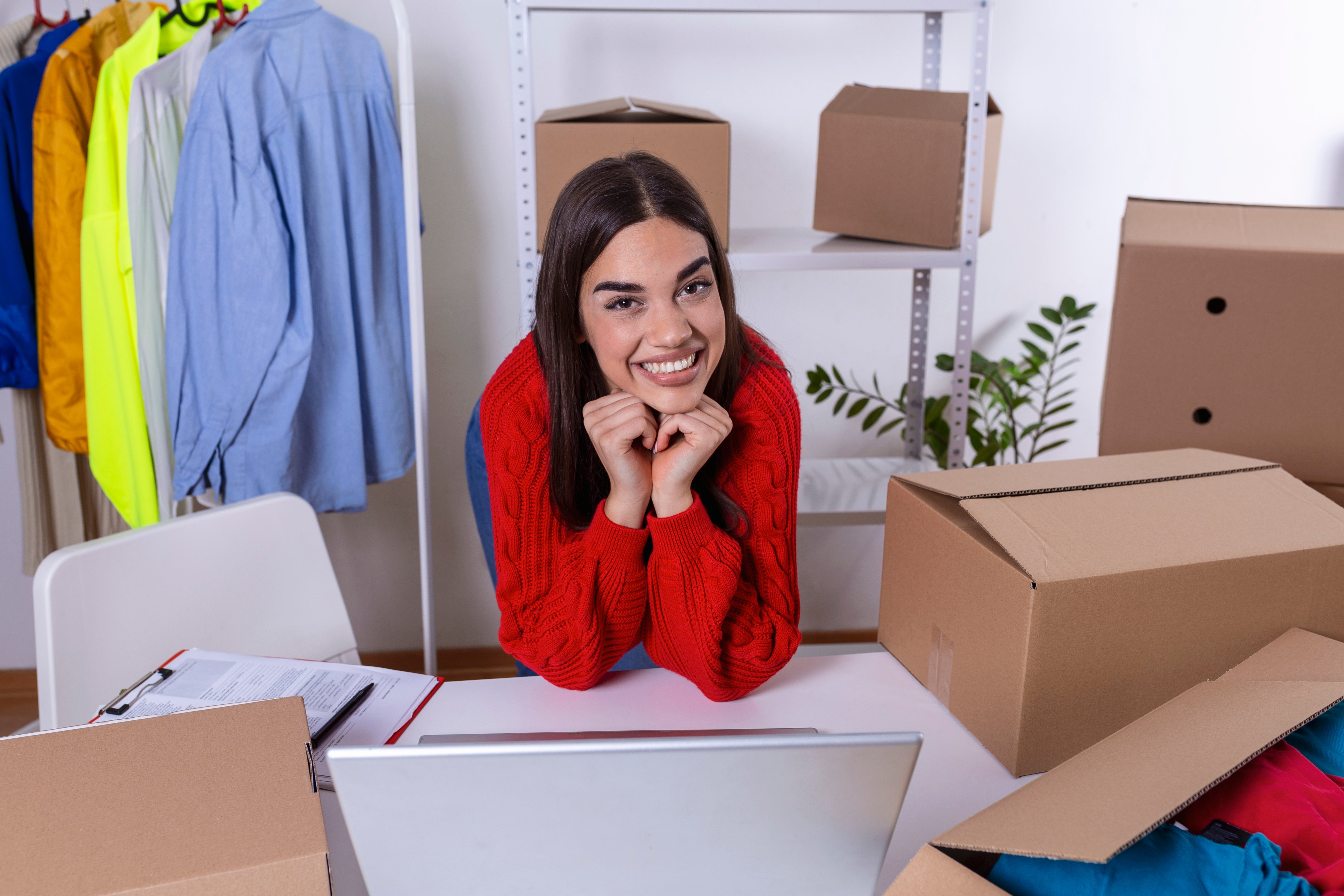 young-woman-owener-of-small-business-packing-product-in-boxes-preparing-it-for-delivery-women-packing-package-with-her-products-that-she-selling-online